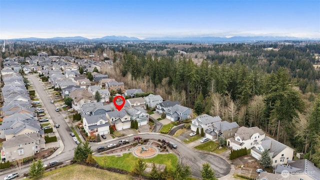 birds eye view of property with a residential view and a forest view