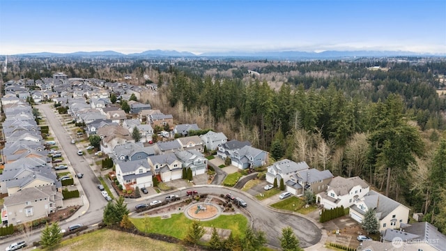 birds eye view of property with a residential view and a wooded view