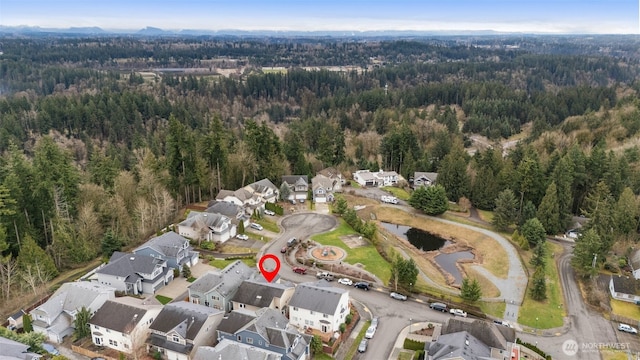 birds eye view of property with a residential view and a view of trees