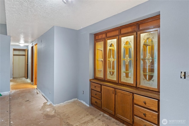 6612 NE Pear St, Suquamish, WA 98392 - corridor featuring a textured ceiling