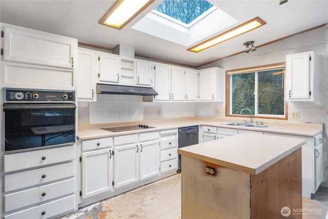 6612 NE Pear St, Suquamish, WA 98392 - kitchen with light countertops, a sink, under cabinet range hood, and black appliances
