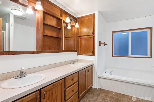 6612 NE Pear St, Suquamish, WA 98392 - bathroom featuring a garden tub, a sink, visible vents, and double vanity