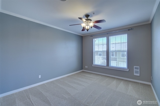 spare room featuring light colored carpet, baseboards, crown molding, and a ceiling fan