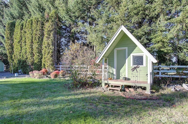 view of shed with fence