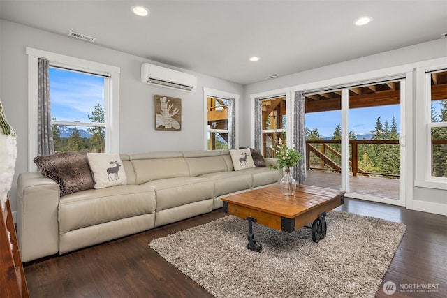 living room with visible vents, an AC wall unit, dark wood-style floors, recessed lighting, and baseboards