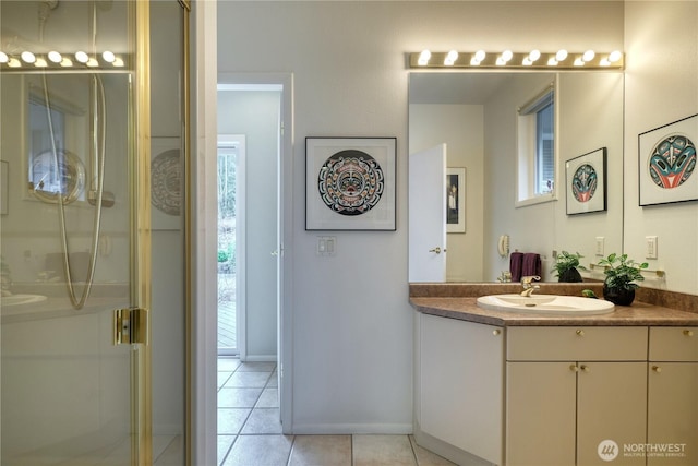 full bathroom with a stall shower, plenty of natural light, vanity, and tile patterned floors