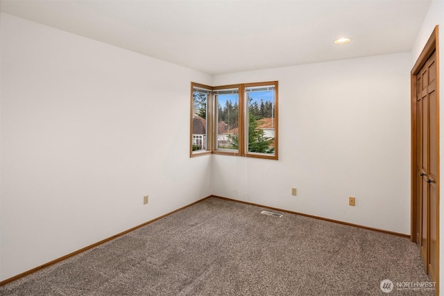 unfurnished bedroom featuring carpet, visible vents, baseboards, and recessed lighting