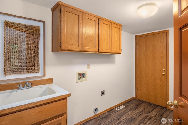 laundry room with dark wood finished floors, hookup for a washing machine, cabinet space, hookup for an electric dryer, and a sink