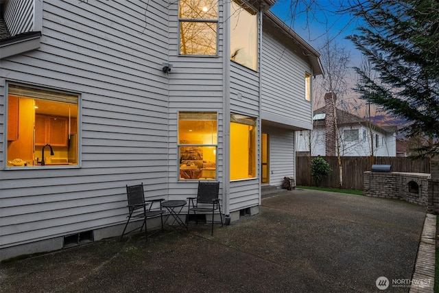 exterior space with a patio and fence