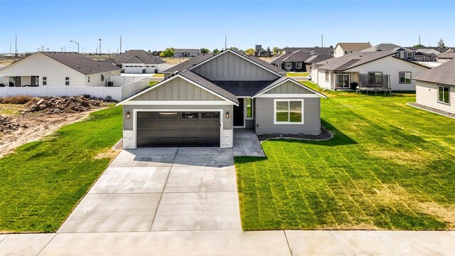 1138 8th Ave NE, Ephrata, WA 98823 - view of front facade with a trampoline, board and batten siding, and a residential view