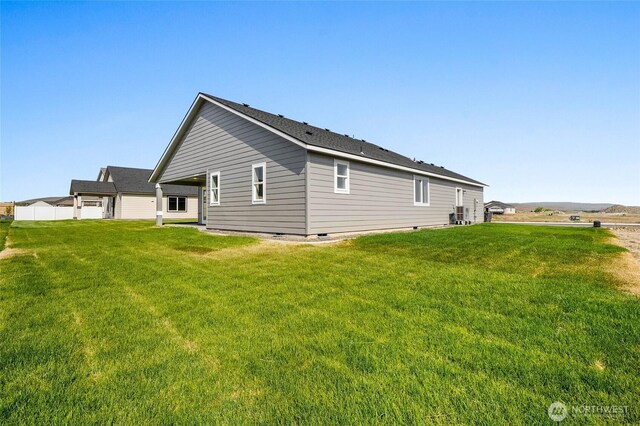 1138 8th Ave NE, Ephrata, WA 98823 - view of home's exterior featuring a lawn and crawl space