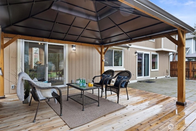 deck with fence, an outdoor hangout area, and a gazebo