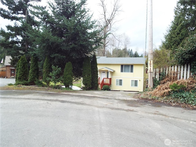 view of front of house with fence