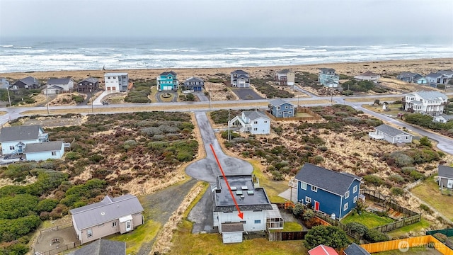 birds eye view of property featuring a water view and a residential view