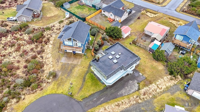 birds eye view of property with a residential view