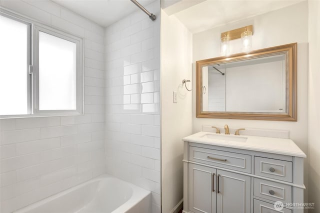 bathroom featuring tub / shower combination and vanity