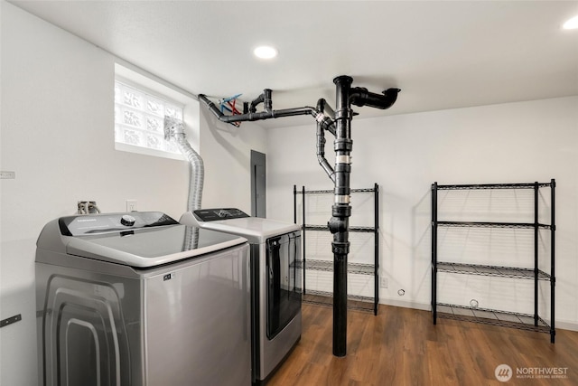 laundry area with recessed lighting, laundry area, independent washer and dryer, and dark wood-style flooring