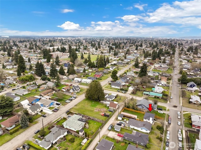 birds eye view of property with a residential view