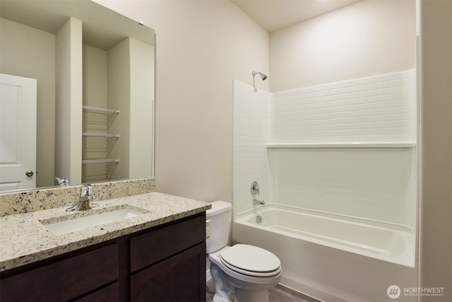 bathroom with shower / bath combination, vanity, and toilet