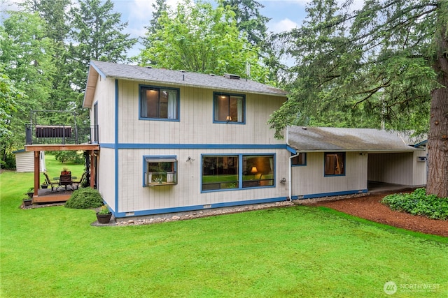 back of house featuring crawl space, a deck, and a yard