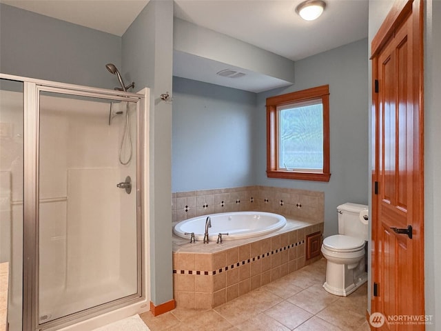 full bathroom with a garden tub, tile patterned flooring, a shower stall, and toilet