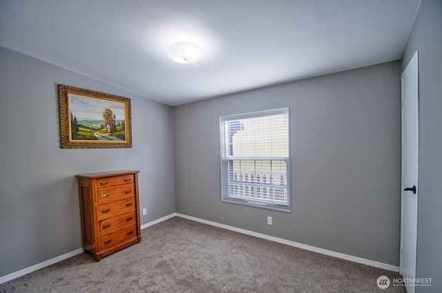 bedroom featuring baseboards and light colored carpet