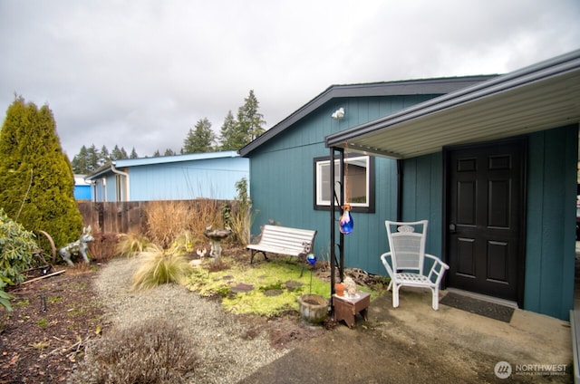 view of property exterior with fence