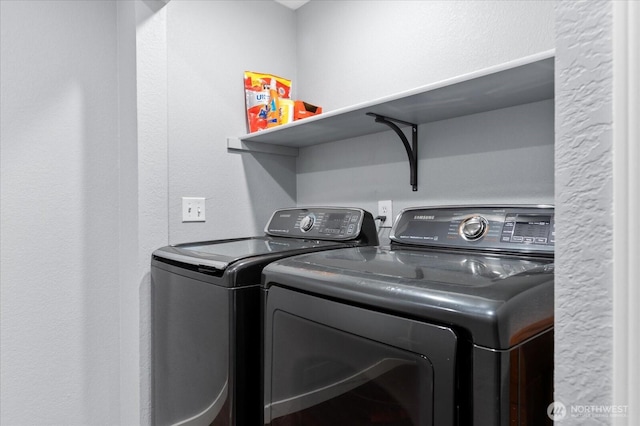 laundry area featuring laundry area and washing machine and dryer