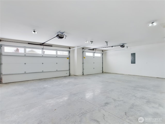 garage featuring electric panel and a garage door opener