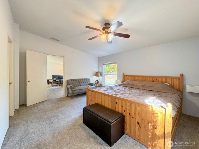 bedroom with ceiling fan, visible vents, and carpet flooring