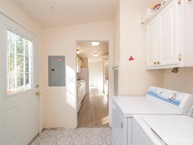 washroom featuring electric panel and washing machine and clothes dryer