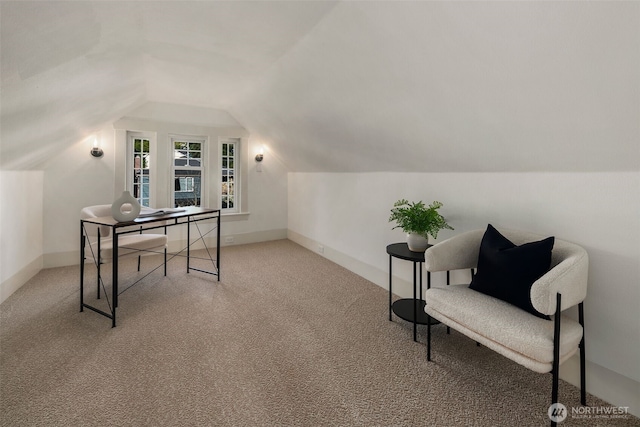 office space with lofted ceiling, light colored carpet, and baseboards