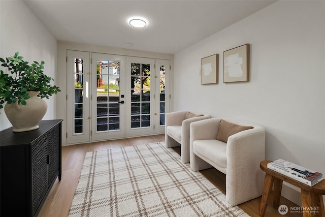 interior space with french doors and light wood finished floors