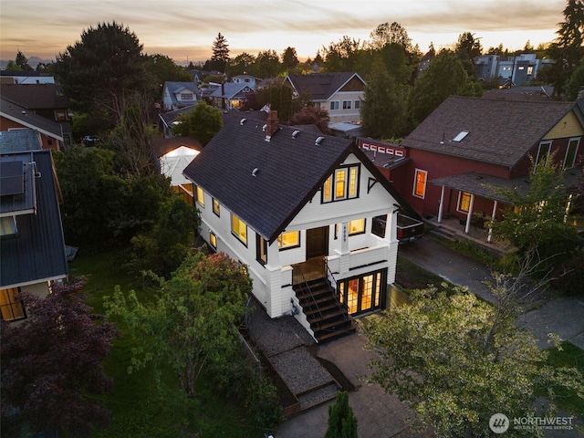 aerial view at dusk with a residential view