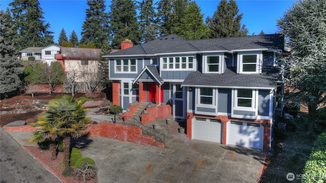 view of front of property with a shingled roof, a garage, driveway, and a chimney