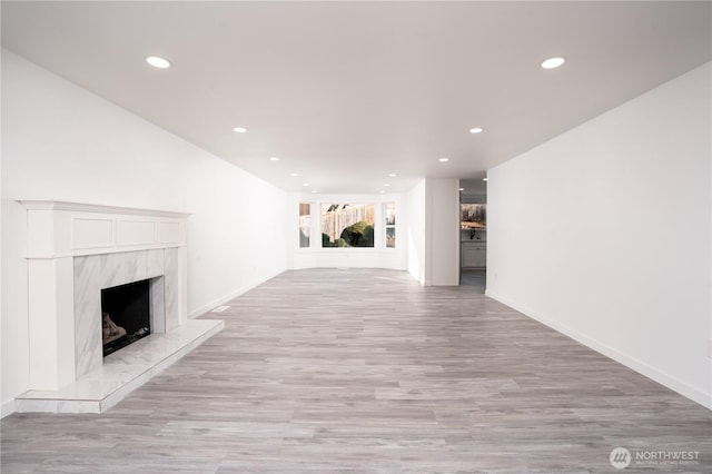 6201 53rd Street Ct W, University Place, WA 98467 - unfurnished living room with recessed lighting, a fireplace, light wood-type flooring, and baseboards