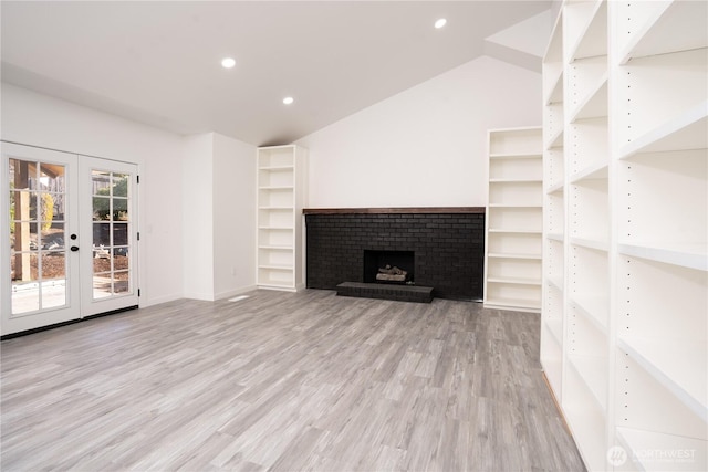 6201 53rd Street Ct W, University Place, WA 98467 - unfurnished living room with recessed lighting, french doors, light wood-style floors, and lofted ceiling