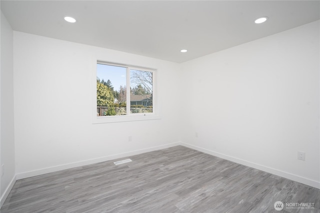 6201 53rd Street Ct W, University Place, WA 98467 - spare room featuring wood finished floors, recessed lighting, baseboards, and visible vents