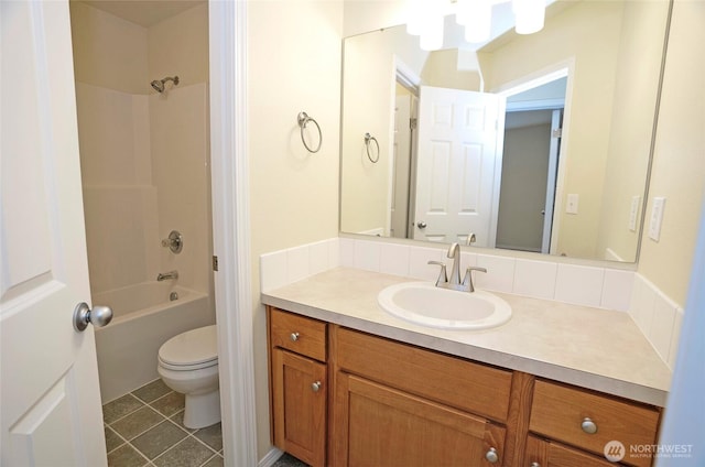 bathroom featuring shower / washtub combination, vanity, toilet, and tile patterned floors