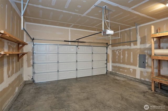 garage featuring a garage door opener and electric panel