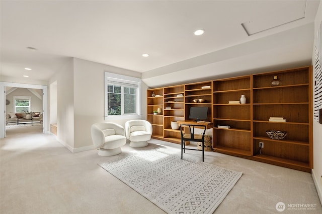 living area with attic access, recessed lighting, light carpet, and baseboards