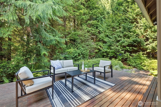 wooden terrace featuring an outdoor living space