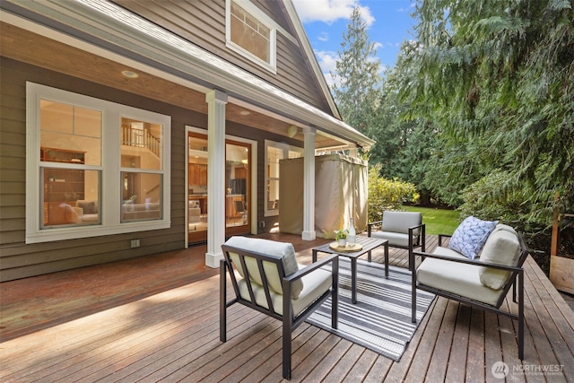 wooden deck with outdoor lounge area