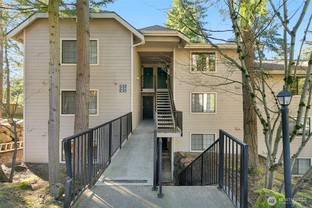 view of front of home featuring stairway