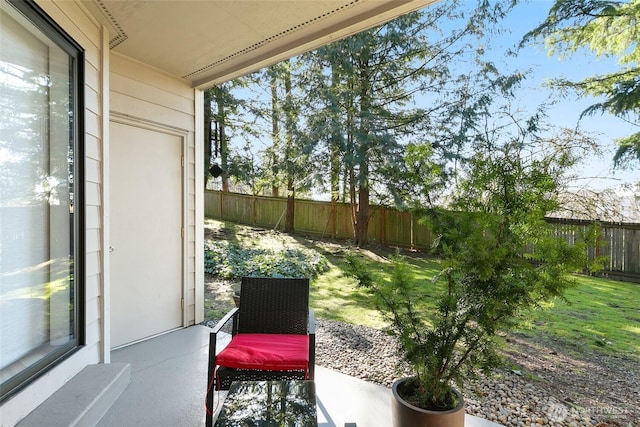 view of patio featuring fence