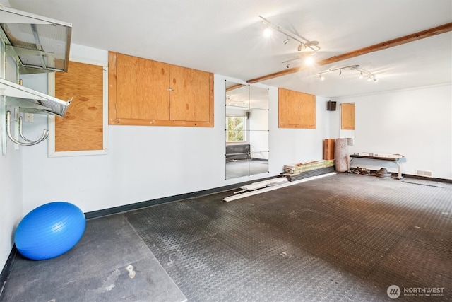 garage with visible vents and baseboards