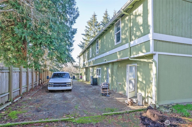 view of side of property with fence