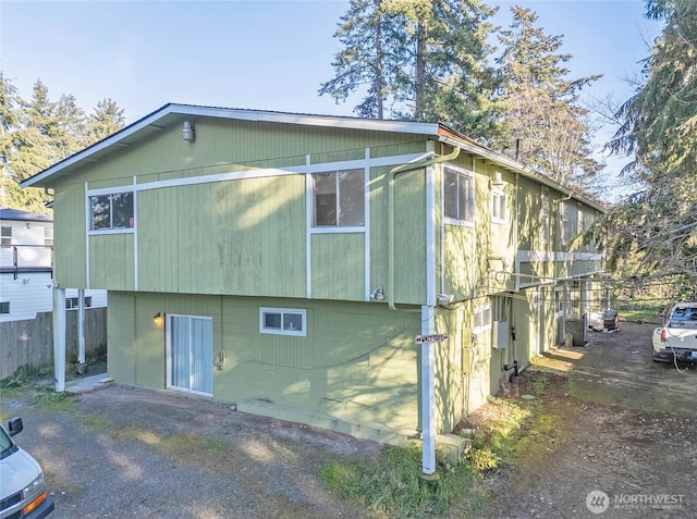 view of property exterior with fence