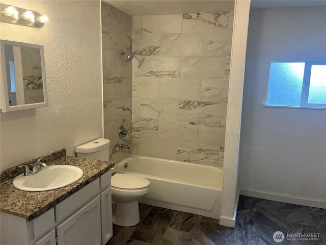 full bathroom with a textured wall, shower / bathing tub combination, toilet, and baseboards