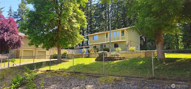 13837 Horsefall Ave SE, Rainier, WA 98576 - back of house with an attached garage and driveway